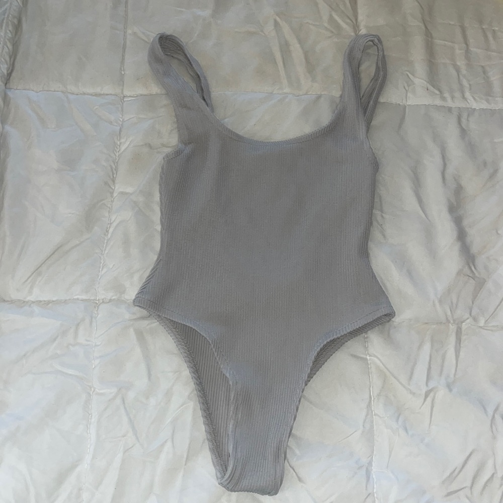 Tan + Lines by Sivan Alya one piece